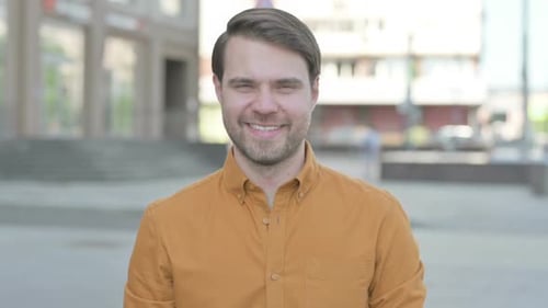 Young Adult Smiling in an Urban Setting