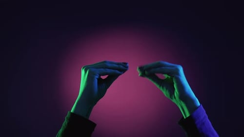 Abstract Hands with Neon Green and Purple Lighting