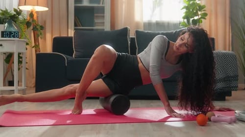 Woman Uses Foam Roller for Thigh Workout
