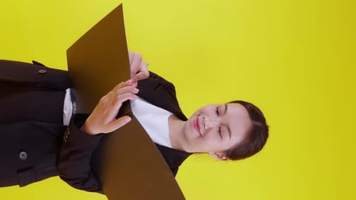 Portrait young asian businesswoman hold folder and writing record document with success.