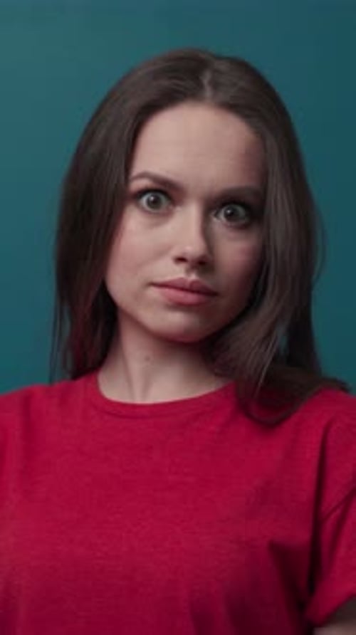 A Portrait of a Woman with Long Hair in a Red Sweater Showcasing Her Elegance and Emotion