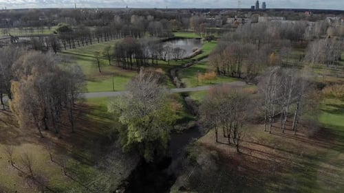 Drone footage of a park in Riga, Latvia. Green trees, rivers, lakes and beautiful scenery in one of
