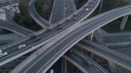 Cinematic Tilt Up Aerial Drone Shot of Highway Interchange with Traffic Flow at Evening