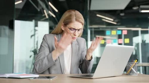 Woman Talking to Computer in Modern Office