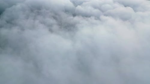 Aerial Footage Above Thick, Gray Clouds in the Daytime