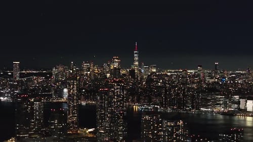 Camera Pans Across Skyline of Lower Manhattan and Its Financial District with Illuminated Modern
