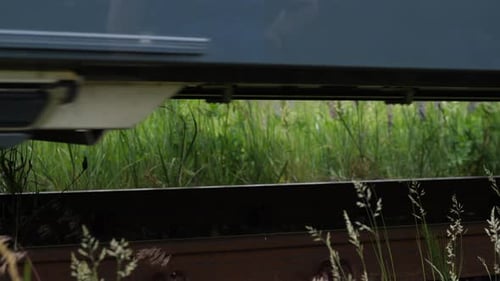 Low Angle Shot of a Train Passing Along the Railway