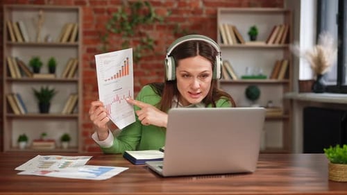 Woman Presents Graphs in Video Conference Call