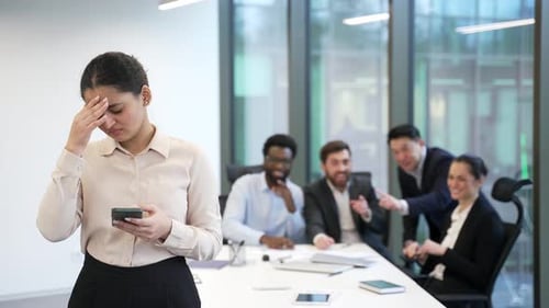 Harassment bullying in office at workplace. Coworkers employees group man and woman Whispering