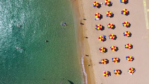 Concept of summer vacation. View from above, stunning aerial view of an amazing beach with beach umb