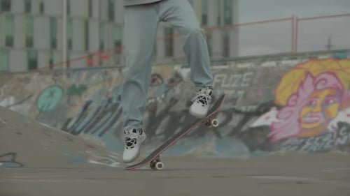 Teenager Performs Skateboard Trick in Skate Park
