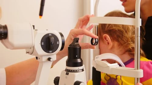 Medical Concept Child's Ophthalmology Doctor Optometrist Checks Eyesight at