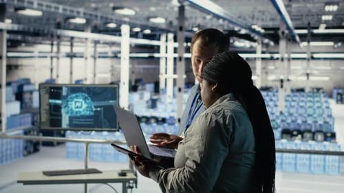 Technicians Working Together in Server Room Optimizing Deep Learning AI Systems