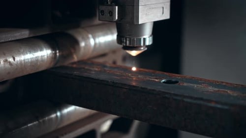 Laser Cutting Machine for Metal The Coordinate Machine Cuts a Rectangular Pipe at the Enterprise The