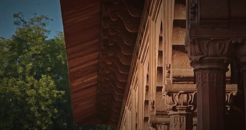Ornate Carved Stone Architecture with Columns and Arches