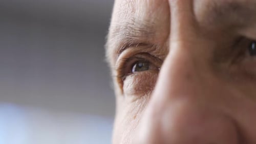 Old man eyes close-up.