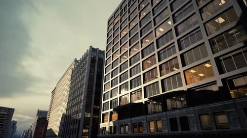 Rascacielos de cristal que reflejan las tonalidades del atardecer y la animada actividad de la ciudad