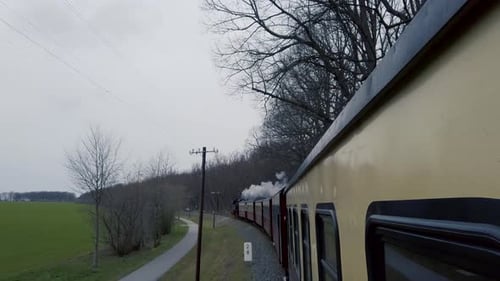 filming outside of a moving steam train