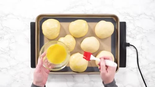 Flat Lay Step By Step Rising Brioche Dough on a Baking Sheet with a Silicone Mat