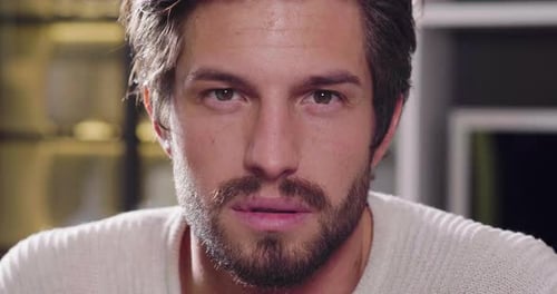 Close up of a portrait of a man looking at the camera and smiling. Concept of: beauty, man, portra