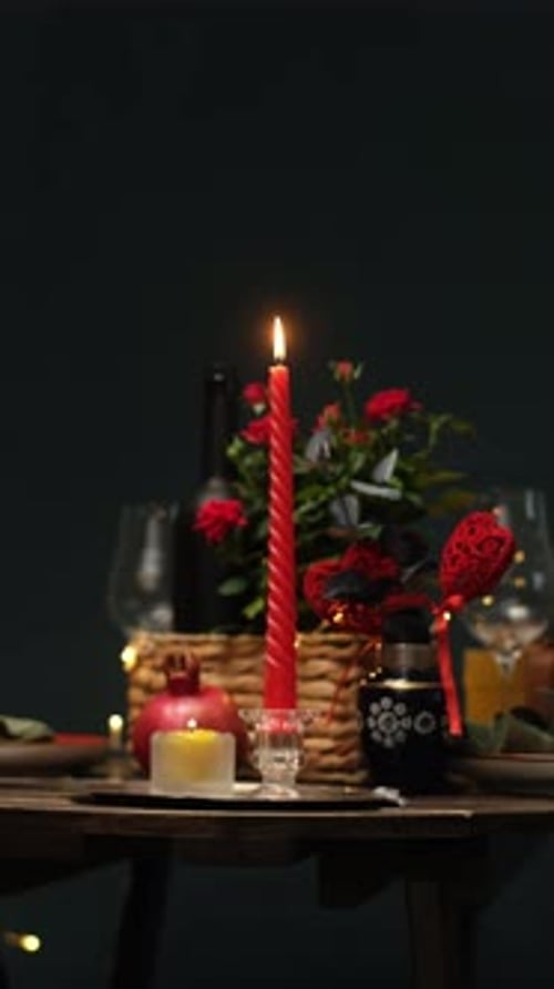 Moody Table Setting with Candles and Roses