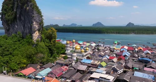Mosque And Stilt Houses In Koh Panyee Village In Phang Nga Bay In Thailand. - aerial shot