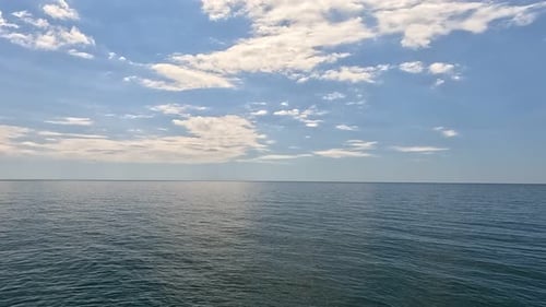 Sea Water Surface Aerial View on Calm Water Surface Camera Flies Over Clear Sea Ocean Sun Glare