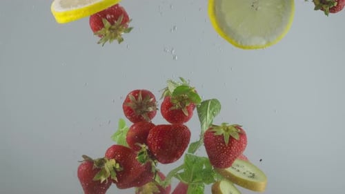 Fresh Fruits Falling into Water