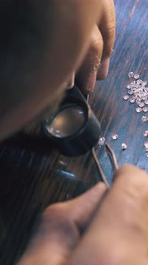 Crafting Diamonds with Magnifying Glass and Precision Tools