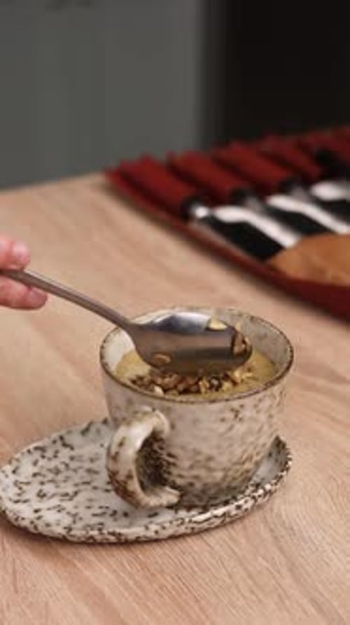 The chef is preparing a puree soup in the kitchen. Close-up