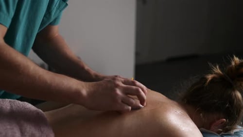 Massage Therapist Doing Back Vacuum Massage With Cups In Spa