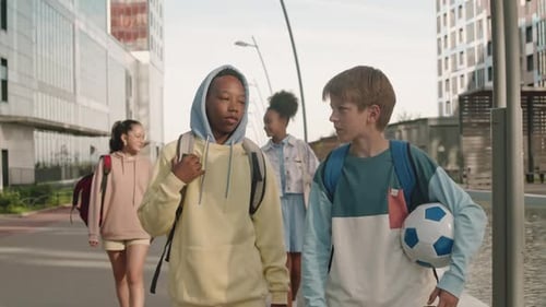 Group of Children Walking Together in Urban Area
