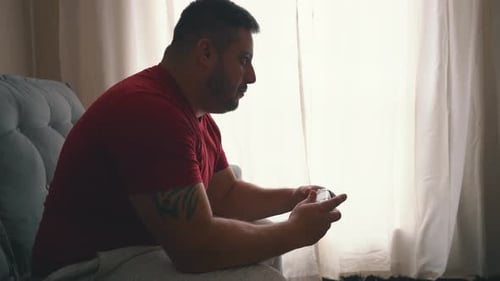 Man Playing Video Games at Home