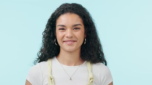 Smiling Young Woman with Curly Hair