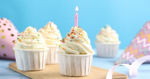 Celebration Cupcakes with Candle and Party Hats