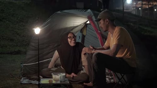 Couple Camping Outdoors at Night