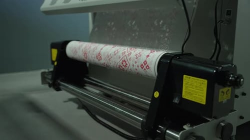 Industrial Machine with Roll of Patterned Textile