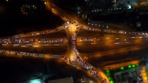 Top Aerial Scenery of Highway with Driving Cars on High Speed Filmed at Night Time in Time Lapse