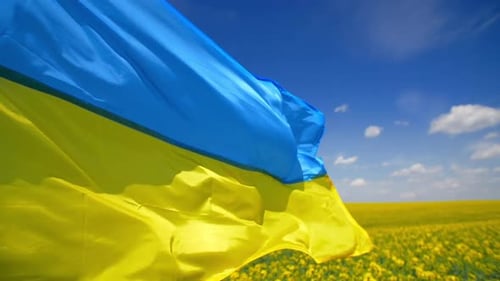 Ukrainian National Flag Flies in the Blue Sky