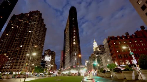 Illuminated Flatiron Building at Night in New York City