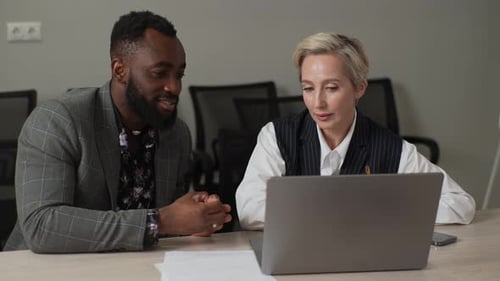 Portrait of Two Engaged Mixedages Business Partners Discussing Online Project Brainstorming on Ideas