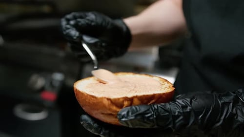 Sauce Spreading on Hamburger Bun