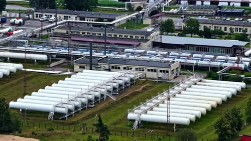 Aerial view of LPG gas storage tanks at an industrial terminal in the Port of Riga