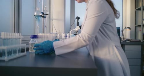 Scientist Using Microscope in Bright Lab Setting