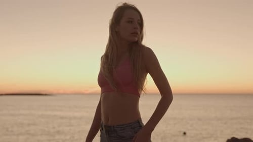 Woman at Sunrise By the Sea