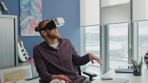 Amazed man exploring virtual 3d cyberspace game at modern office in slow motion