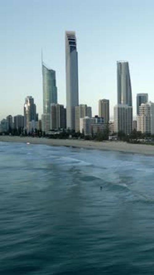Vertical drone lateral movement waves breaking surfer riding Gold Coast Queensland Australia