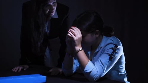 Young Woman Handcuffed During Police Interrogation
