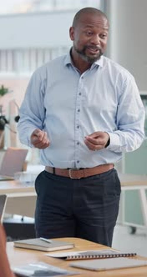 Business, man or speaker for presentation, meeting or training in office with feedback