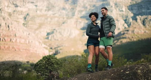 Active Couple Hiking Together in the Mountains
